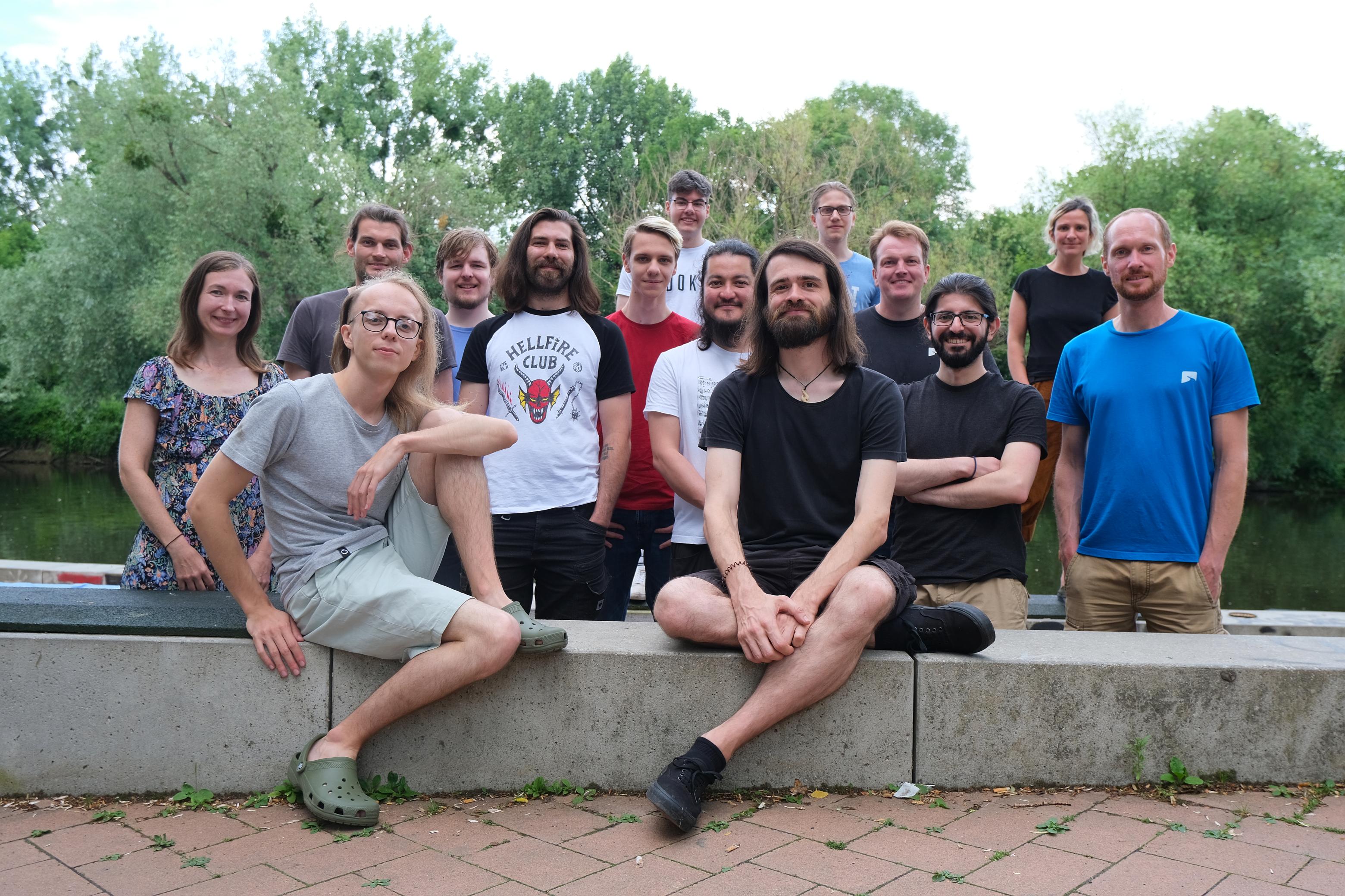 Tutanota team is posing for the picture after the BBQ next to the river near the office in the summer of 2022